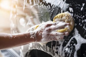 hand washing a soapy car