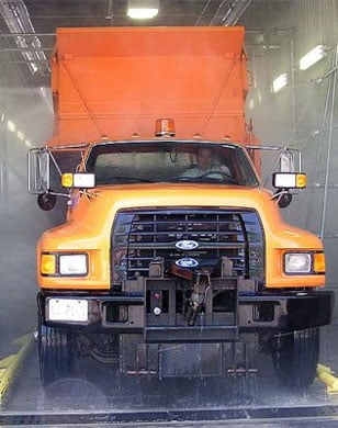 orange truck in vehicle wash