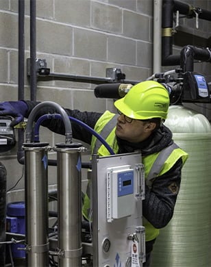 technician with car wash water equipment