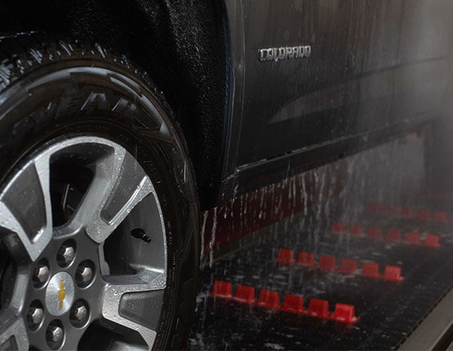 Close up of car tire inside a tunnel car wash