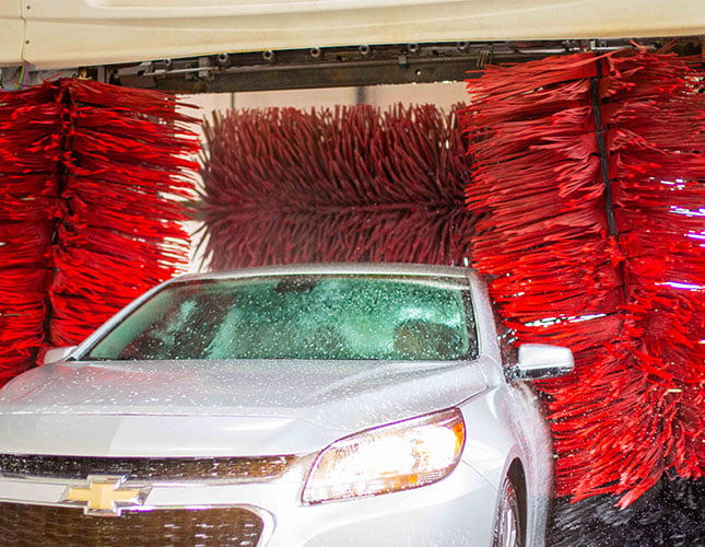 sedan inside a soft-touch car wash