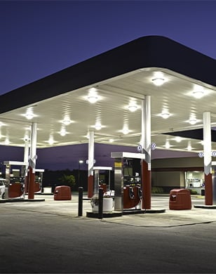 Outside shot of a convenience store and gas pumps