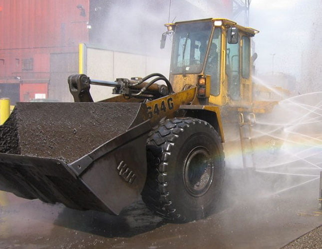 construction equipment going through heavy-duty equipment wash