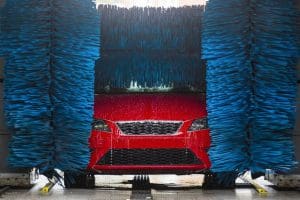 red car in car wash