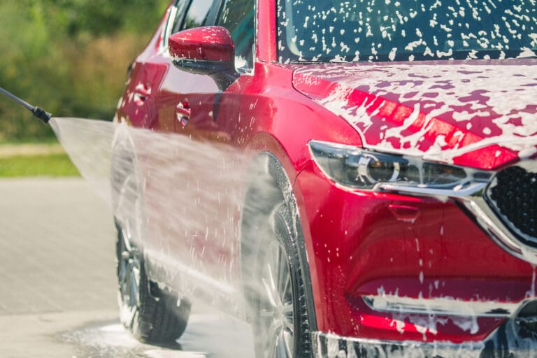 spray washing a car stock image