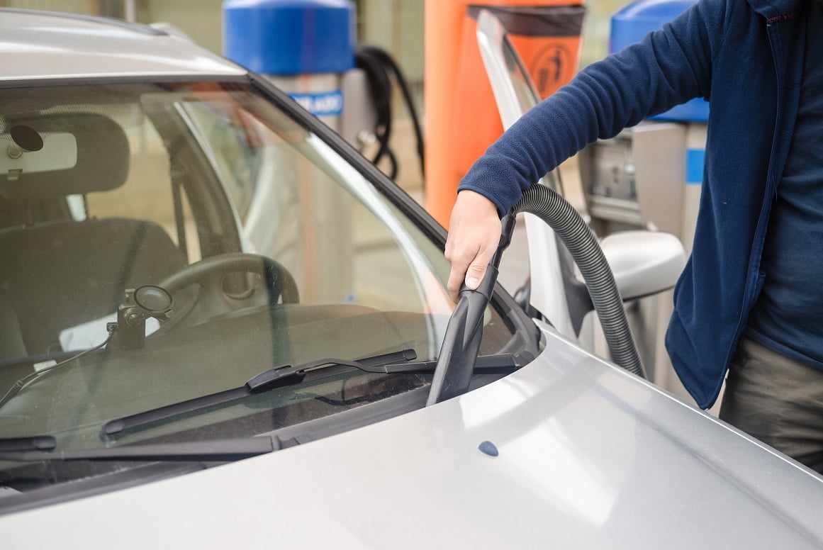 vacuuming car at car wash